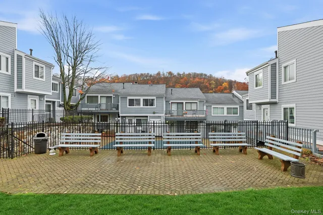 a view of a house with swimming pool and porch