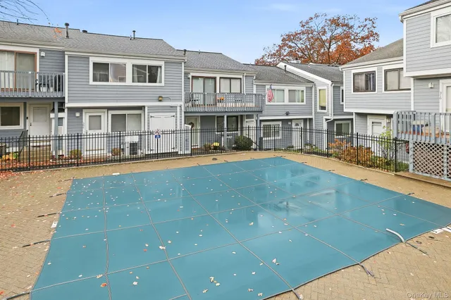 a view of a roof deck with wooden floor and fence