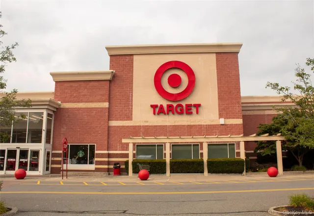 a front view of a building with retail shops