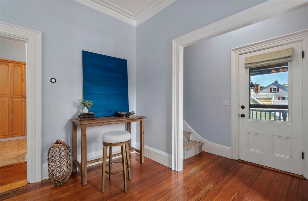 409 Atlantic Avenue Marblehead, MA 01945 - Photo 14 of 29 a view of a hallway with wooden floor table and windows