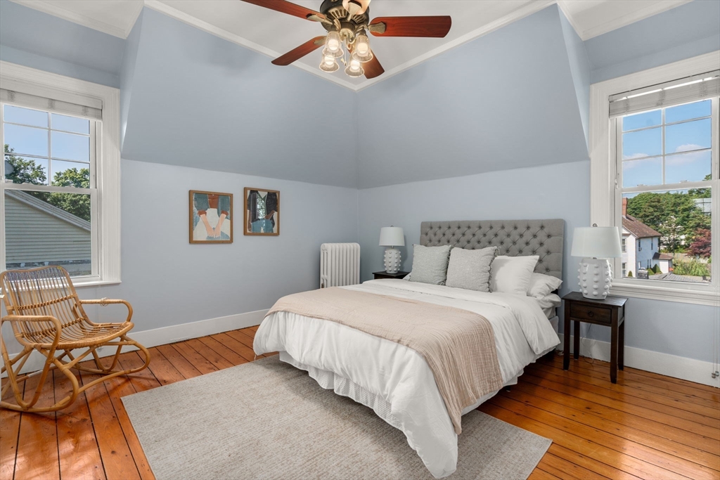 409 Atlantic Avenue Marblehead, MA 01945 - Photo 16 of 29 a bedroom with a bed and a table