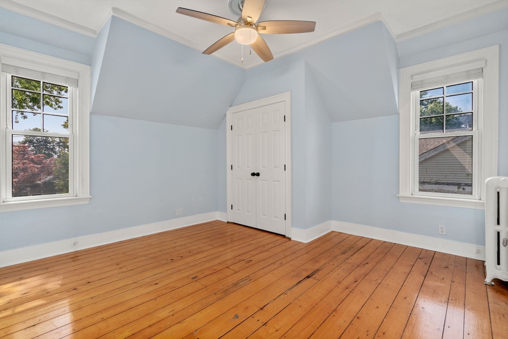 409 Atlantic Avenue Marblehead, MA 01945 - Photo 18 of 29 a view of empty room with wooden floor and fan