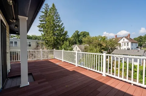 a balcony with wooden floor