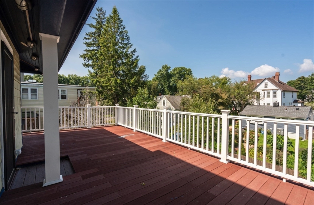 409 Atlantic Avenue Marblehead, MA 01945 - Photo 22 of 29 a balcony with wooden floor