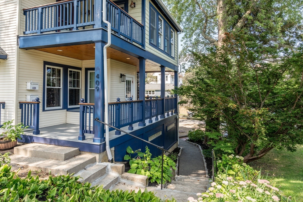 409 Atlantic Avenue Marblehead, MA 01945 - Photo 27 of 29 a view of a house with brick walls and flower plants