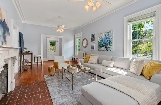 a living room with furniture and a window
