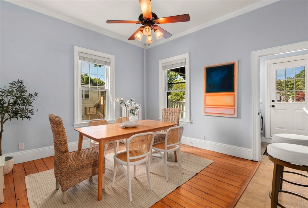 409 Atlantic Avenue Marblehead, MA 01945 - Photo 5 of 29 a dining room with furniture a rug and a chandelier