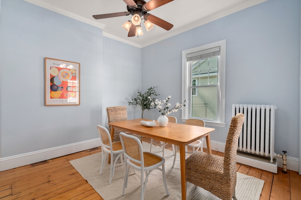 409 Atlantic Avenue Marblehead, MA 01945 - Photo 6 of 29 a dining room with furniture potted plants and wooden floor