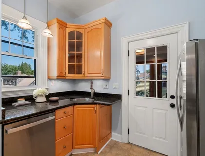 a kitchen that has a sink and a window in it