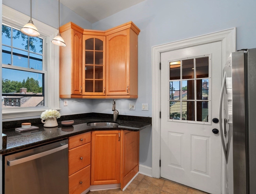 409 Atlantic Avenue Marblehead, MA 01945 - Photo 9 of 29 a kitchen that has a sink and a window in it