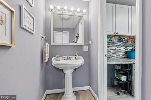 a bathroom with a sink and mirror