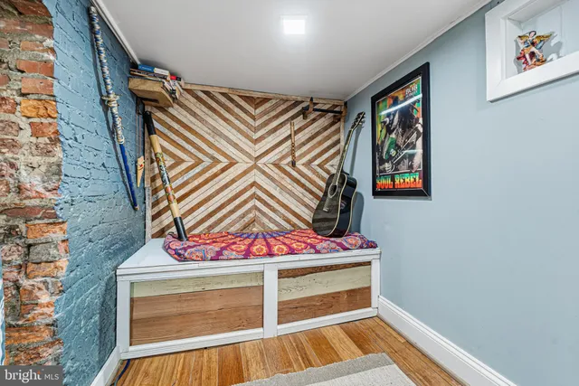 a view of an entryway with wooden floor