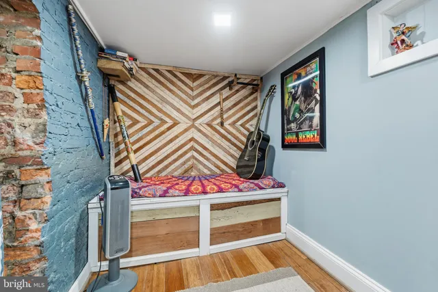 a view of an entryway with wooden floor