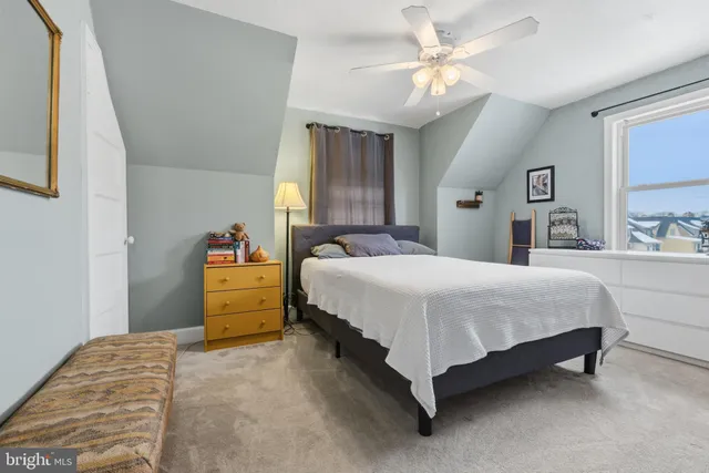 a bed room with a bed and a chandelier