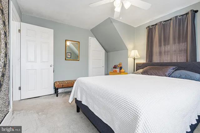 a car parked in front of white house