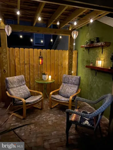 a front view of a house with a yard and a fountain