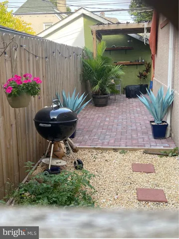 a view of a porch with a table and chairs