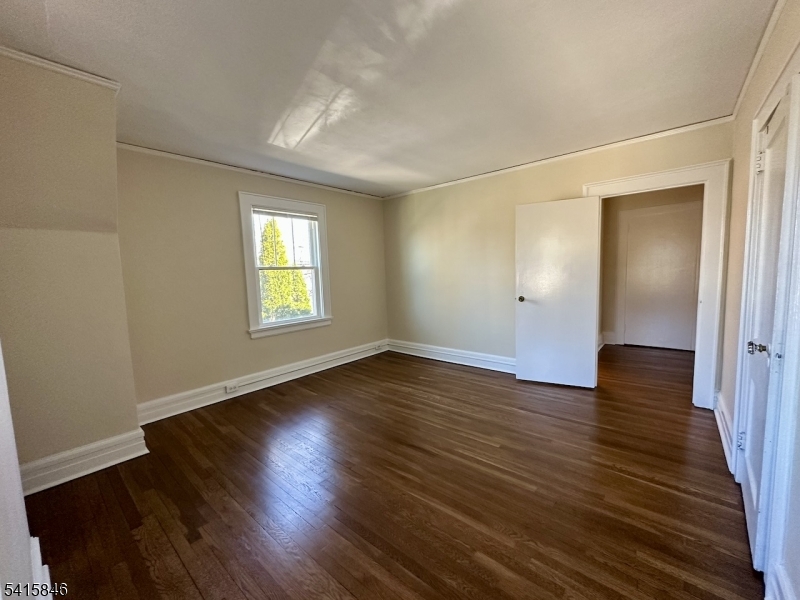 283 Main Street Chatham, NJ 07928 - Photo 11 of 15 an empty room with wooden floor and windows