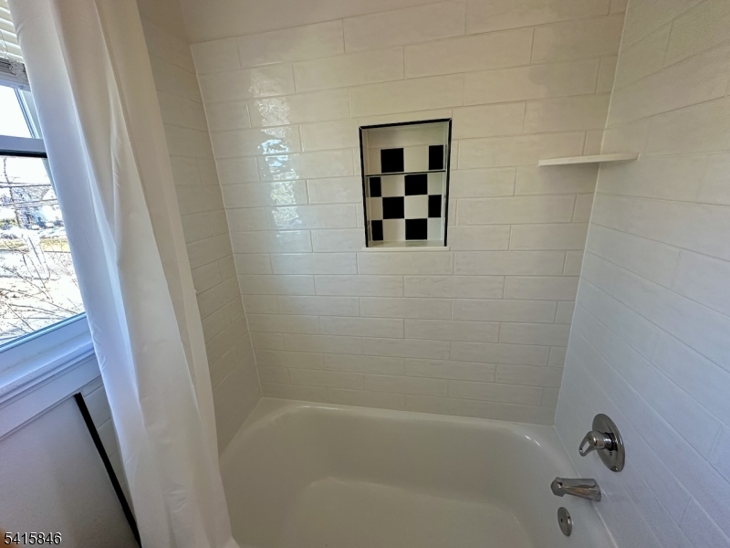 283 Main Street Chatham, NJ 07928 - Photo 14 of 15 a bathroom with a bathtub