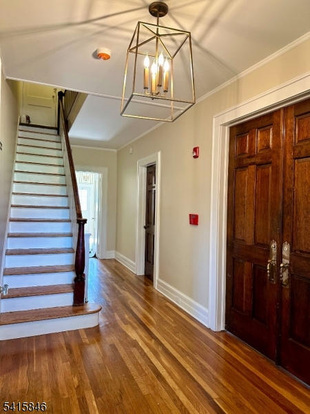 283 Main Street Chatham, NJ 07928 - Photo 2 of 15 a view of a hallway with wooden floor and staircase