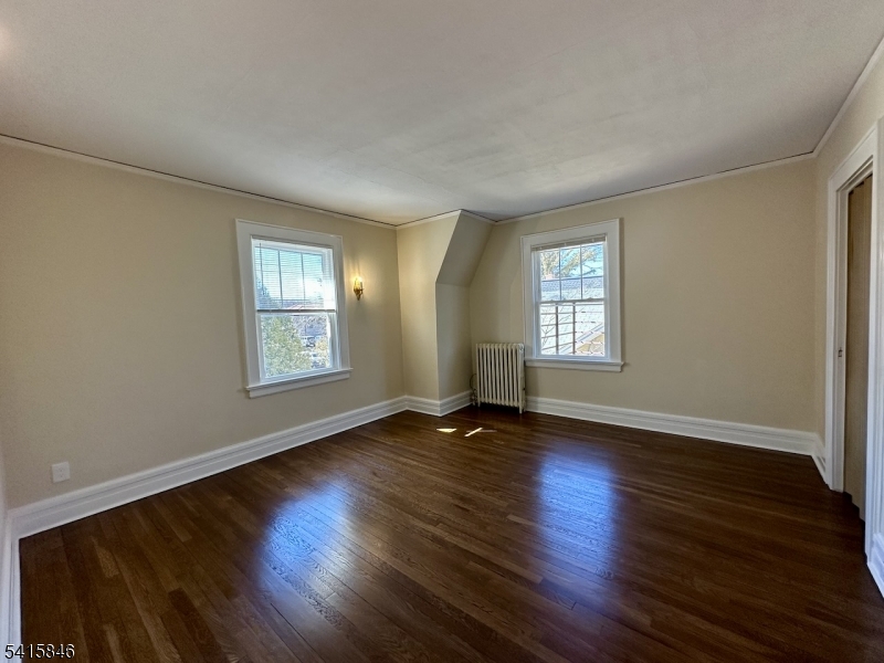 283 Main Street Chatham, NJ 07928 - Photo 7 of 15 an empty room with wooden floor and windows