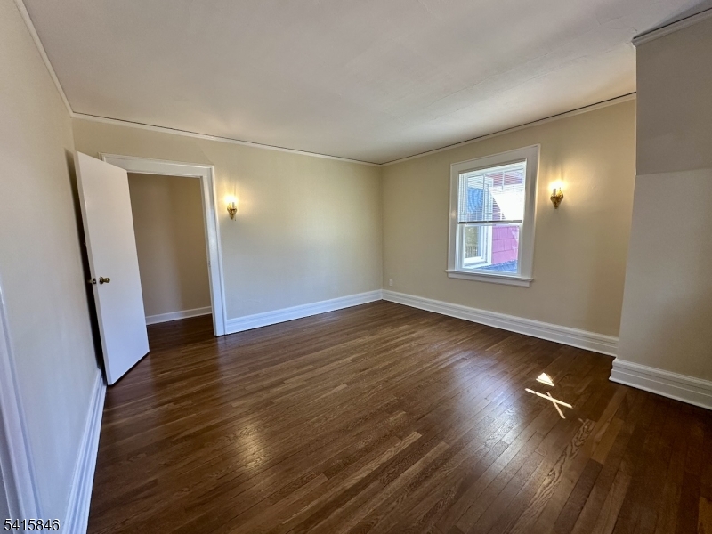 283 Main Street Chatham, NJ 07928 - Photo 8 of 15 an empty room with wooden floor and windows
