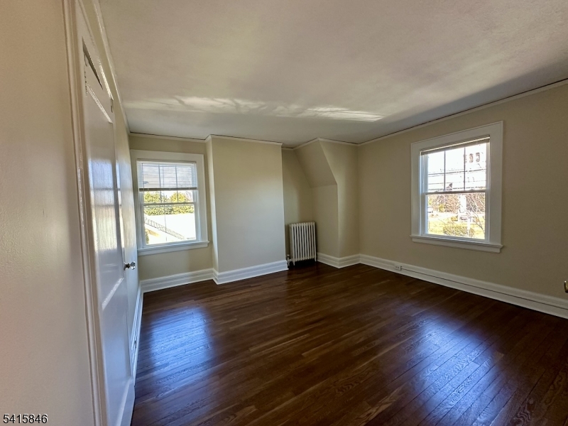 283 Main Street Chatham, NJ 07928 - Photo 9 of 15 an empty room with wooden floor and windows