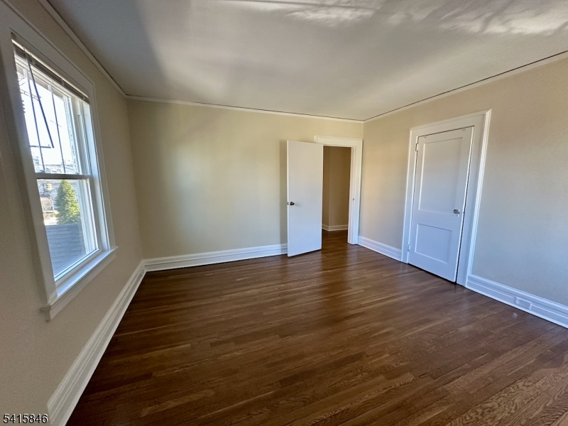 283 Main Street Chatham, NJ 07928 - Photo 10 of 15 a view of an empty room with wooden floor and a window