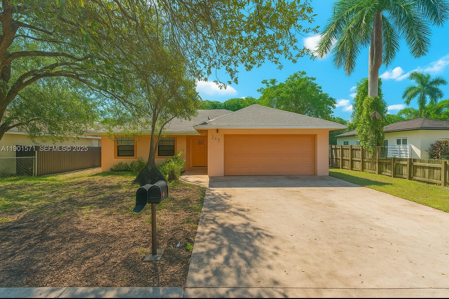 222 Northwest 14th Street Homestead, FL 33030 - Photo 1 of 26 a front view of a house with garden