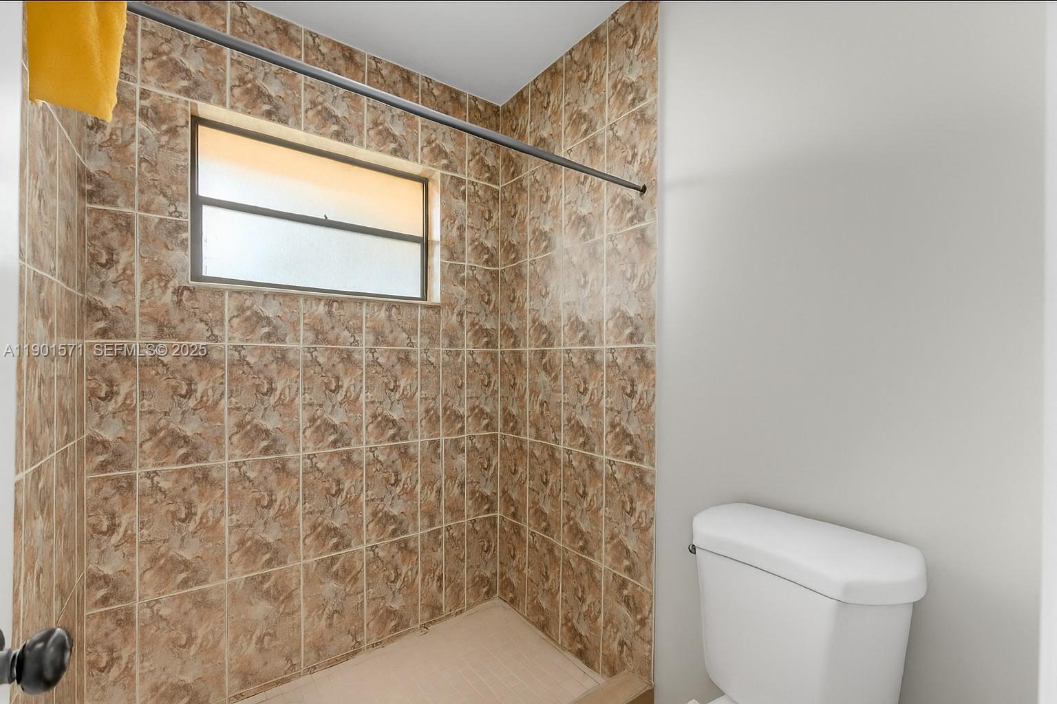 222 Northwest 14th Street Homestead, FL 33030 - Photo 11 of 26 a bathroom with a toilet and a shower