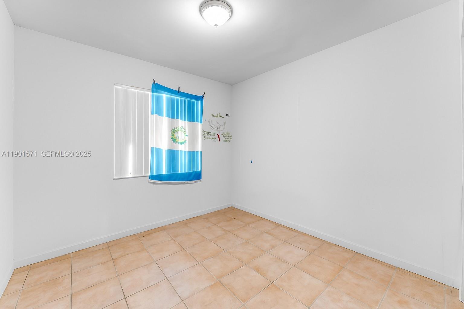 222 Northwest 14th Street Homestead, FL 33030 - Photo 15 of 26 a view of an empty room with a window