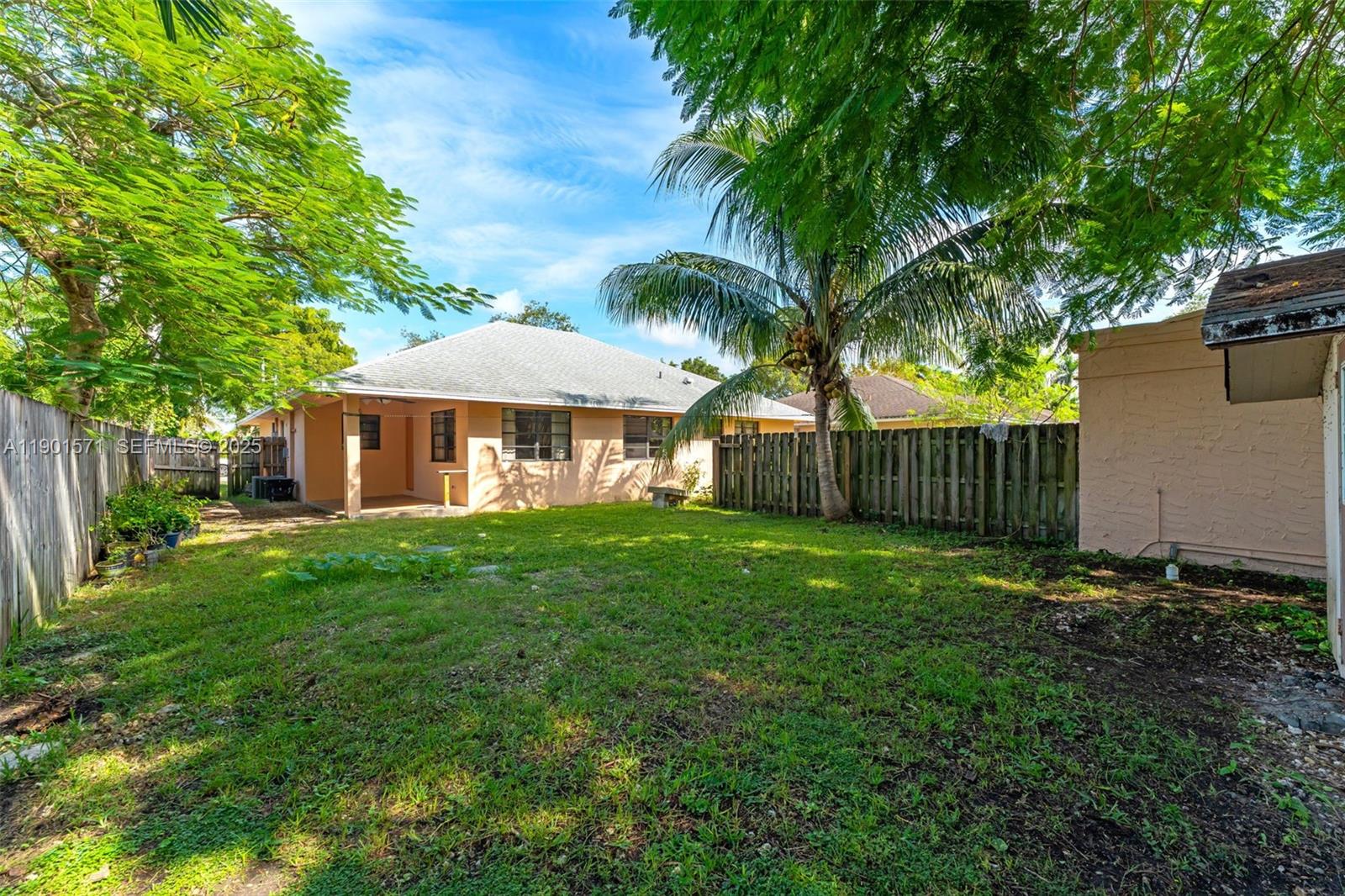 222 Northwest 14th Street Homestead, FL 33030 - Photo 19 of 26 a view of a house with a yard and tree s