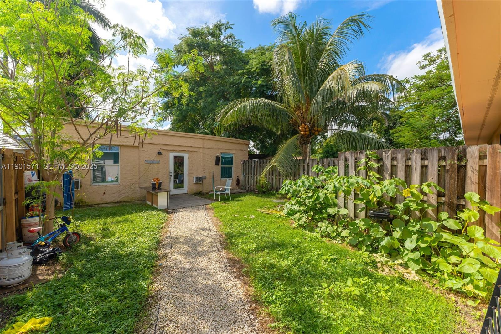 222 Northwest 14th Street Homestead, FL 33030 - Photo 20 of 26 a view of a house with a garden