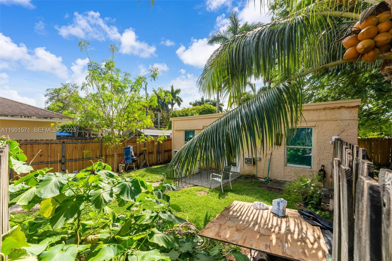 222 Northwest 14th Street Homestead, FL 33030 - Photo 2 of 26 a view of a yard with plants and palm trees