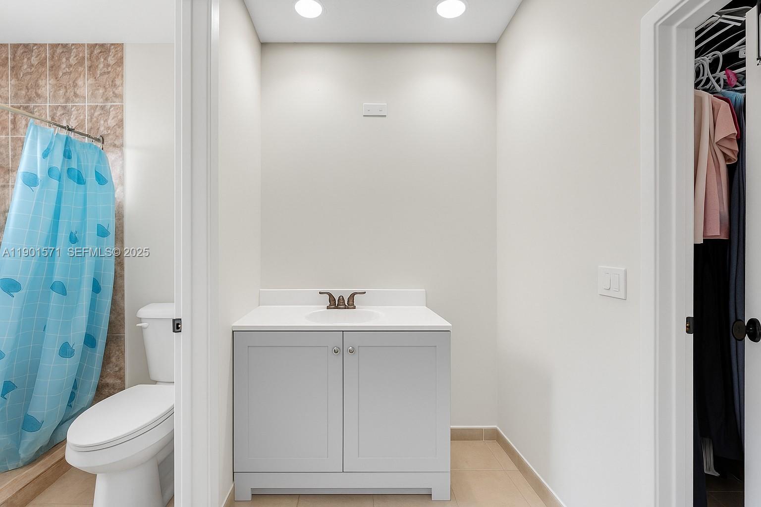 222 Northwest 14th Street Homestead, FL 33030 - Photo 10 of 26 a bathroom with a sink a toilet and shower