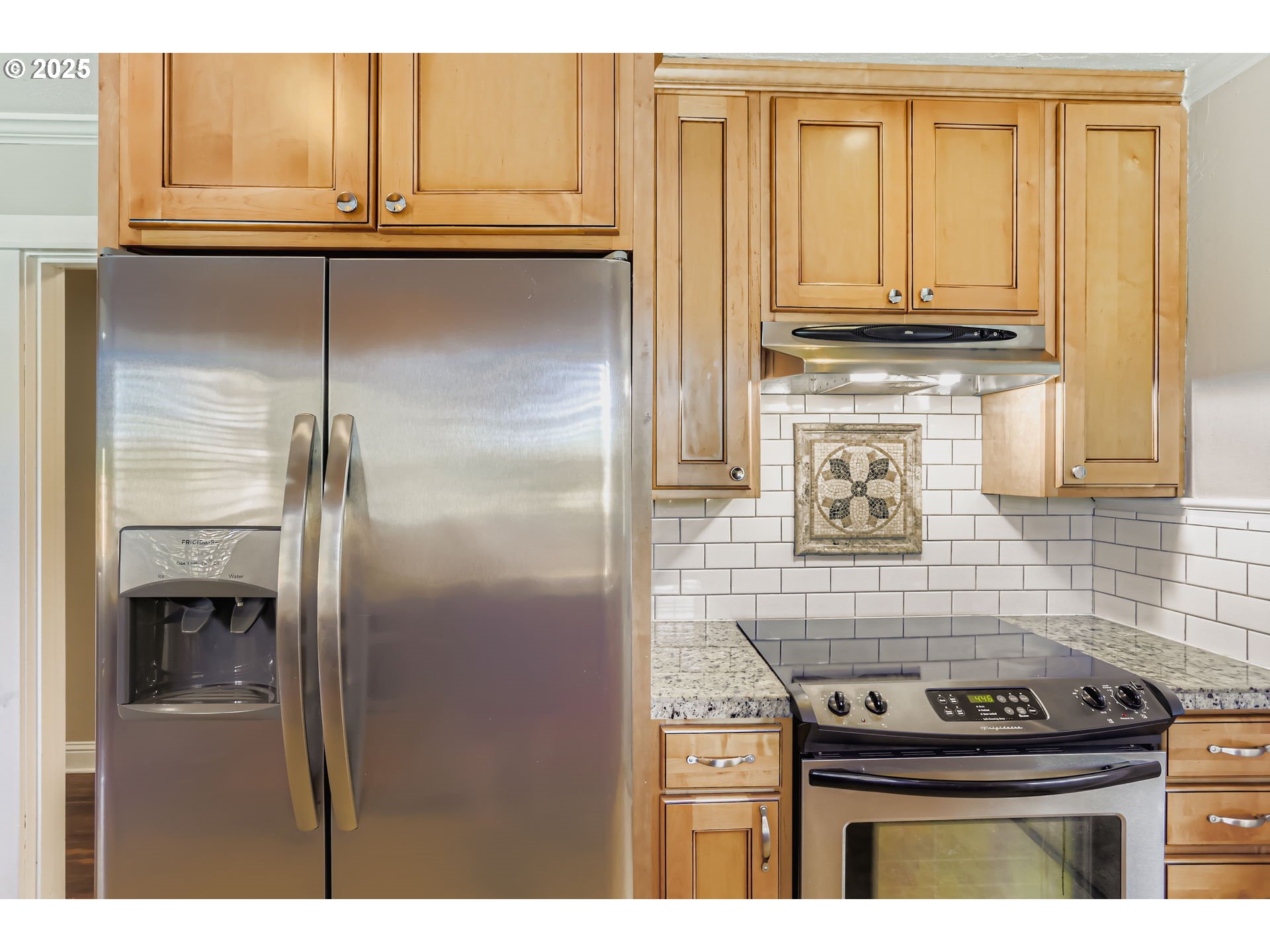 13860 Southwest Butner Road Beaverton, OR 97006 - Photo 11 of 29 a kitchen with stainless steel appliances granite countertop a stove and a refrigerator
