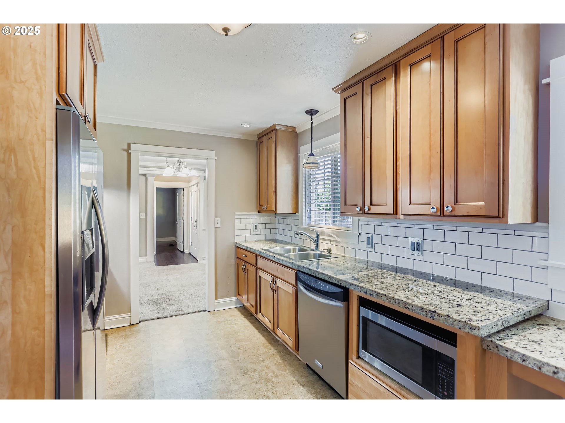 13860 Southwest Butner Road Beaverton, OR 97006 - Photo 13 of 29 a kitchen with stainless steel appliances granite countertop a sink stove and refrigerator