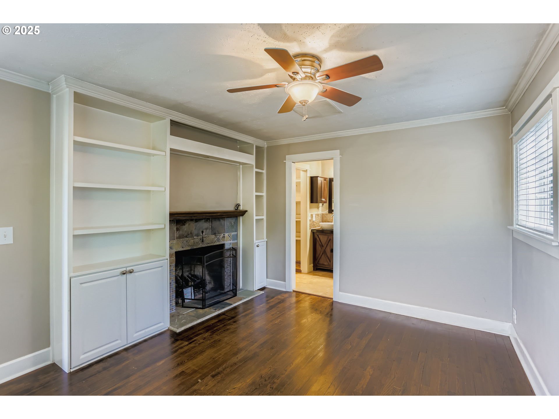 13860 Southwest Butner Road Beaverton, OR 97006 - Photo 15 of 29 a view of an empty room with a window and fireplace