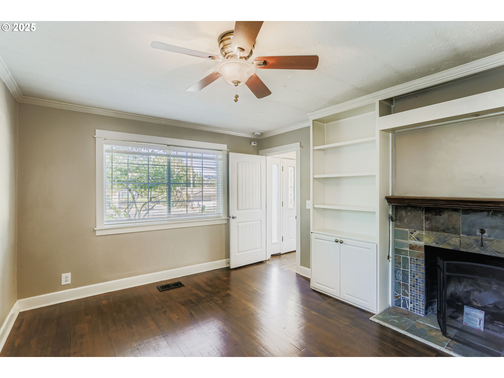 13860 Southwest Butner Road Beaverton, OR 97006 - Photo 16 of 29 a view of an empty room with a window and fireplace