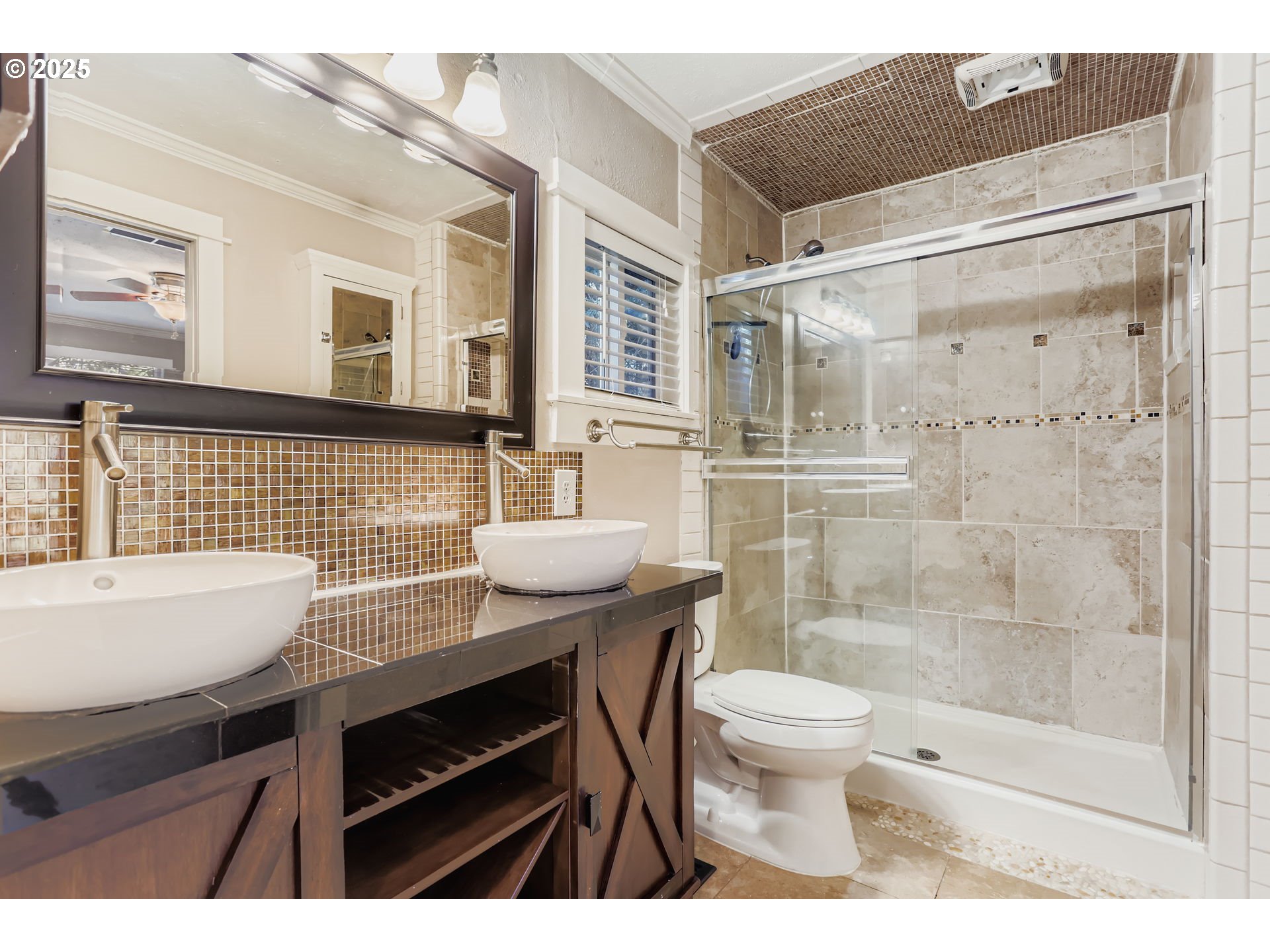 13860 Southwest Butner Road Beaverton, OR 97006 - Photo 18 of 29 a bathroom with a sink a toilet a mirror and a glass door shower