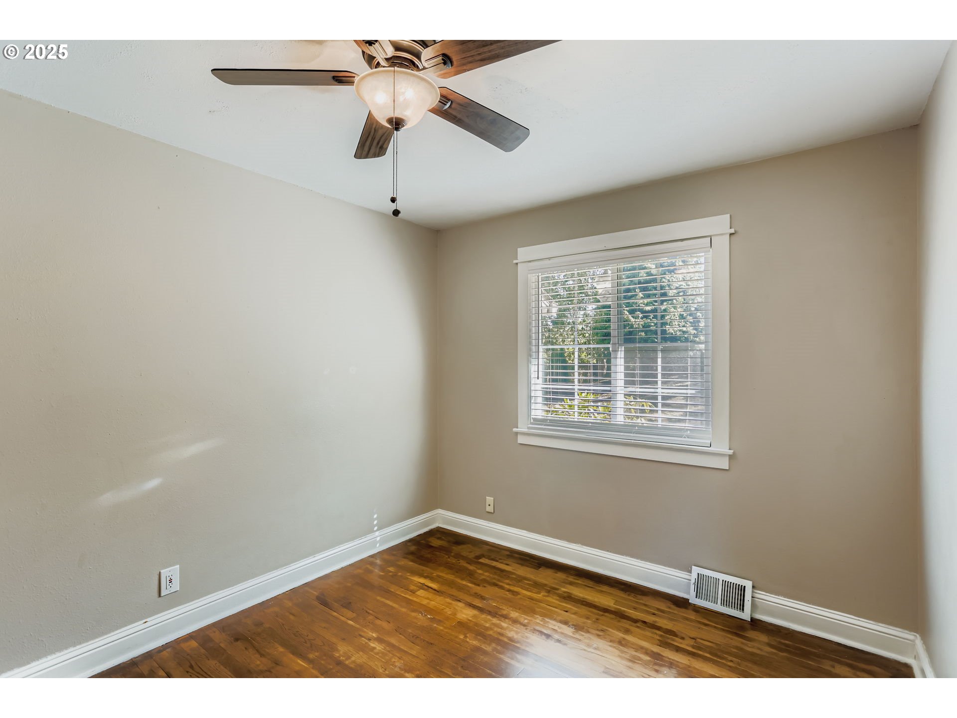 13860 Southwest Butner Road Beaverton, OR 97006 - Photo 20 of 29 an empty room with a window and a fan