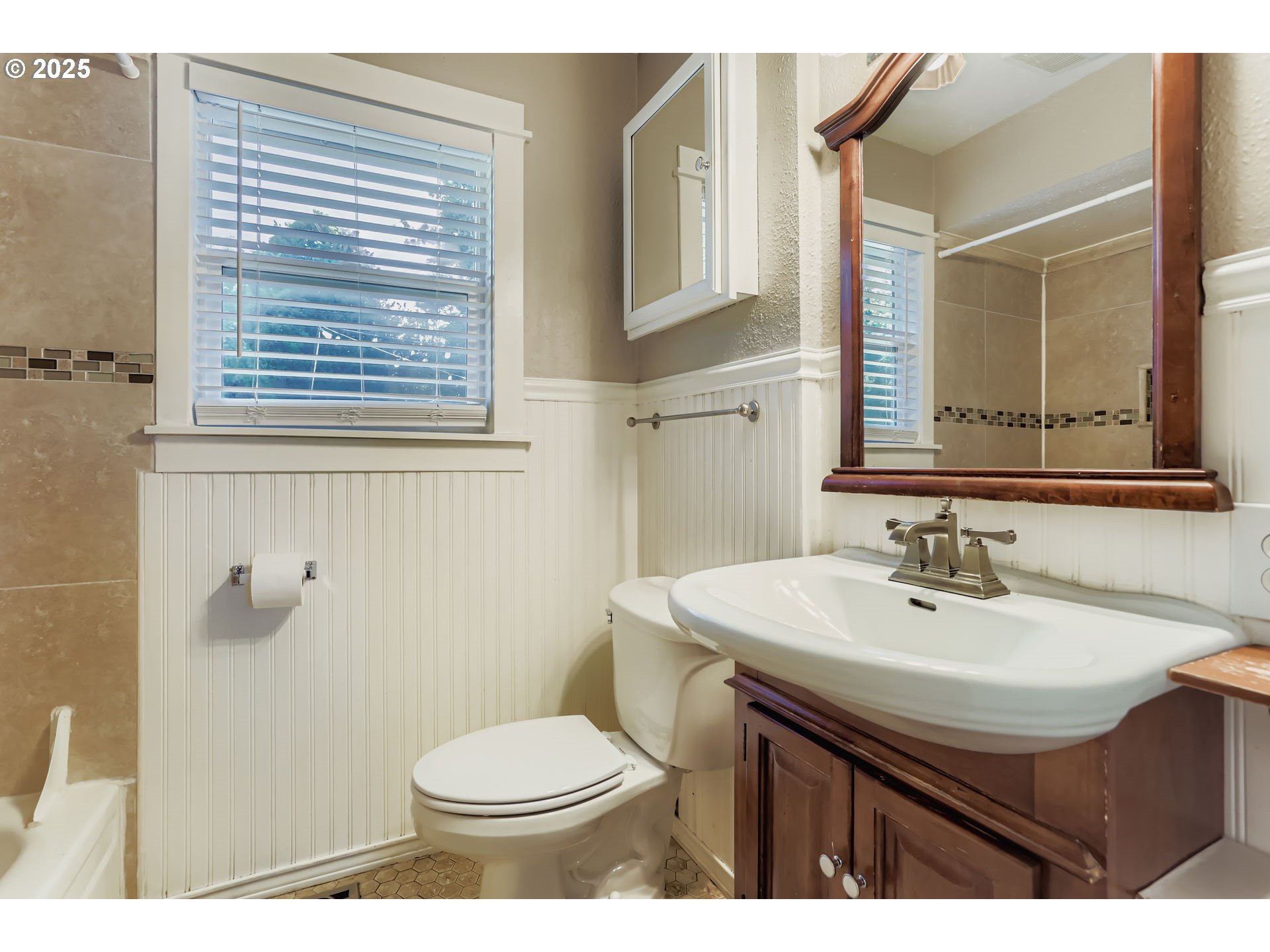 13860 Southwest Butner Road Beaverton, OR 97006 - Photo 24 of 29 a bathroom with a sink a toilet and mirror