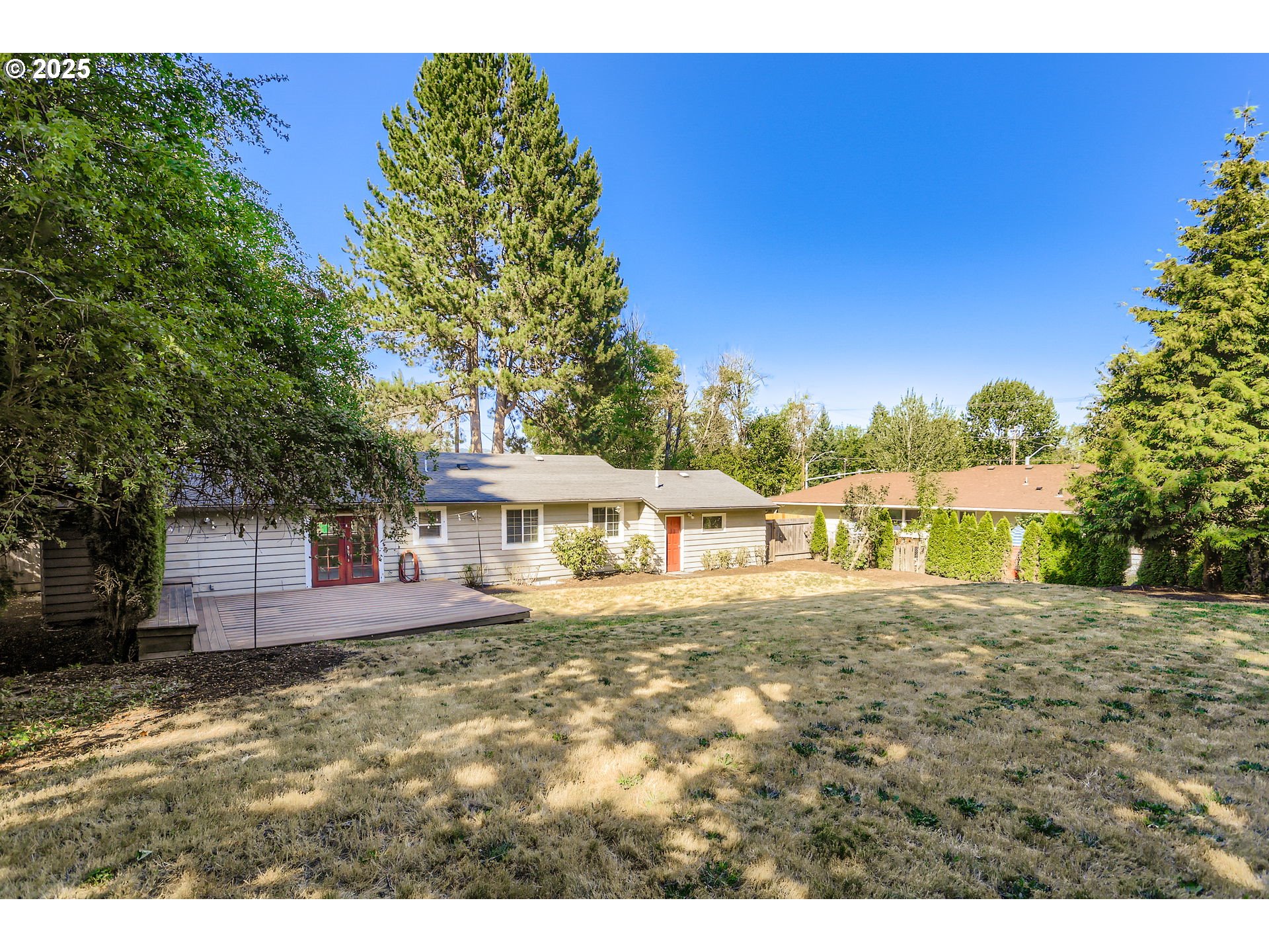 13860 Southwest Butner Road Beaverton, OR 97006 - Photo 27 of 29 a front view of a house with a yard
