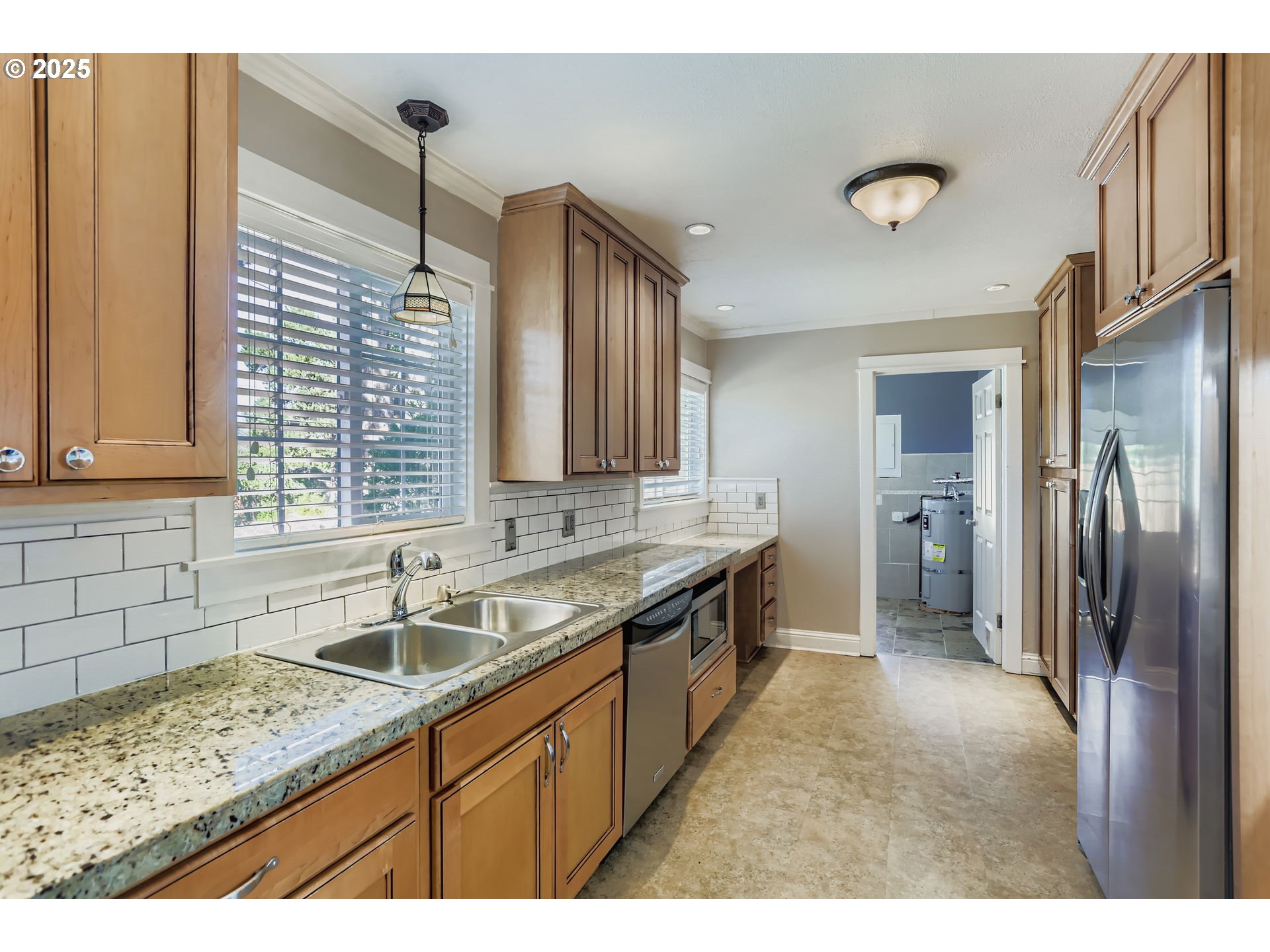 13860 Southwest Butner Road Beaverton, OR 97006 - Photo 10 of 29 a kitchen with a sink stove and refrigerator