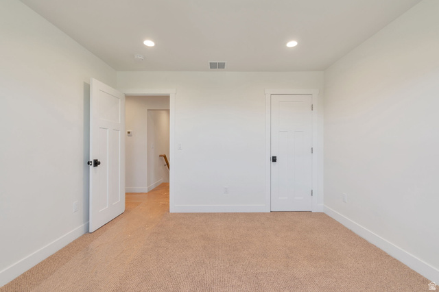 1820 West Farmhouse Flats Road Peoa, UT 84061 - Photo 30 of 79 Neutral tone walls with recessed lighting and a textured carpet
