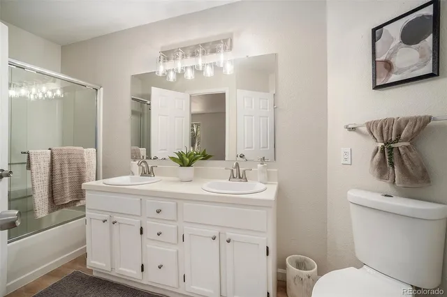 a view of wooden floor and windows in an empty room