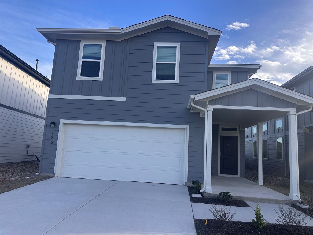 123 Jackman Drive Buda, TX 78610 - Photo 1 of 1 a front view of a house with a garage