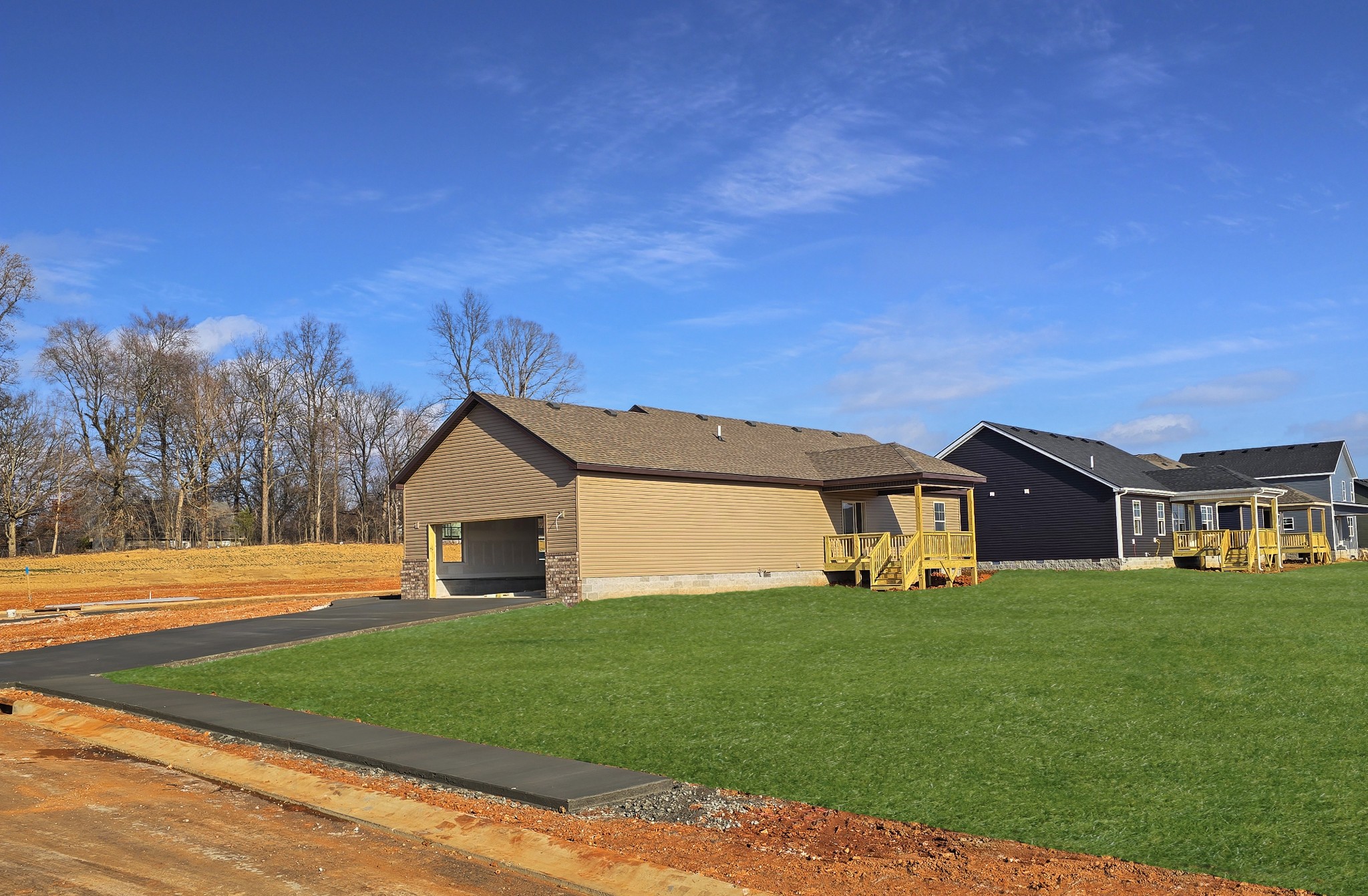 28 Echo Ridge Oak Grove, KY 42262 - Photo 9 of 12 a view of a yard in front of a house with large trees