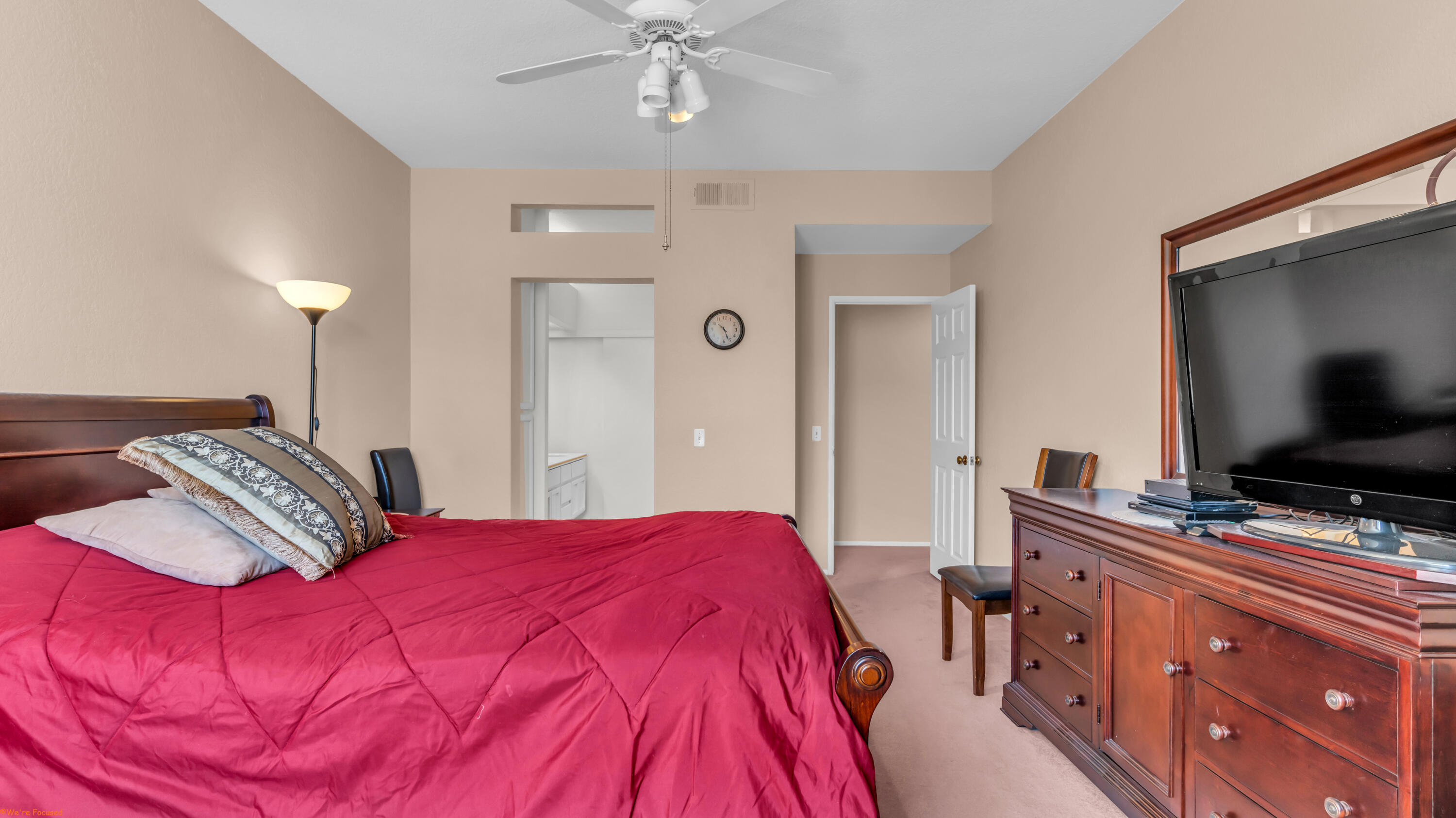 401 El Cielo Road, Unit 236 Palm Springs, CA 92262 - Photo 18 of 29 a bedroom with a bed and a flat screen tv