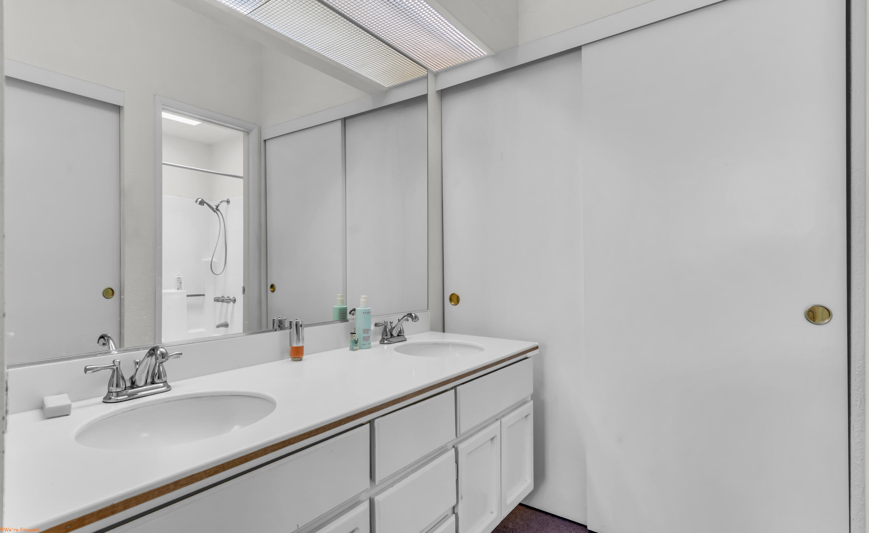 401 El Cielo Road, Unit 236 Palm Springs, CA 92262 - Photo 19 of 29 a bathroom with a sink and a mirror